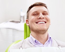 Smiling man sitting in dental office