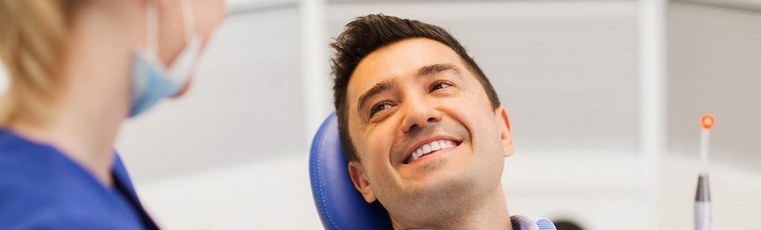 man smiling in the dental chair